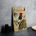 a vintage-style book or magazine cover titled "Red-Headed Woodpecker" with illustrations of the bird and its natural habitat.