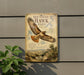 a sign for the Red-tailed Hawk soaring, with a detailed illustration of the bird in flight and a scenic landscape in the background.
