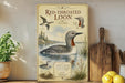 a vintage-style poster of a red-throated loon, with illustrations of the bird and its natural habitat, such as a lake and surrounding vegetation.