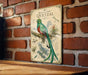 a vintage-style illustration of a quetzal bird perched on a branch, with detailed botanical illustrations and text providing information about the species.