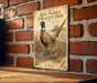 A vintage-style metal sign featuring a pheasant standing on a brick wall, with the text "Ring-Necked Pheasant Pair" and "Phasian colchus Family: Pheasianidae" printed on it.