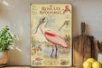 a vintage-style illustration of a pink spoonbill bird, with detailed illustrations of the bird's beak, legs, and feathers, along with text providing information about the species.