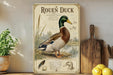 a vintage-style illustration of a Rouen Duck, with a wooden paddle and a potted plant in the background.