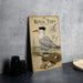 A vintage-style metal plaque featuring an illustration of a seagull, with text describing the bird and its habitat.