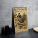 a vintage-style metal sign with an illustration of a grouse drumming bird, placed on a gray countertop next to some black camera lenses.