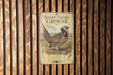 a sign with a picture of a Sharp-tailed grouse, which is a type of grouse.