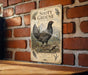 A vintage-style metal sign featuring an illustration of a grouse bird, mounted on a brick wall.