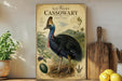 a poster of a cassowary, a large flightless bird native to Australia, displayed on a shelf next to a wooden cutting board and some fruit.