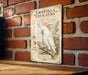 a vintage-style illustration of a white cockatoo perched on a branch, with a brick wall in the background.
