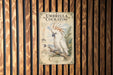 a poster of a white cockatoo perched on a branch, with a detailed illustration of the bird and its natural habitat.