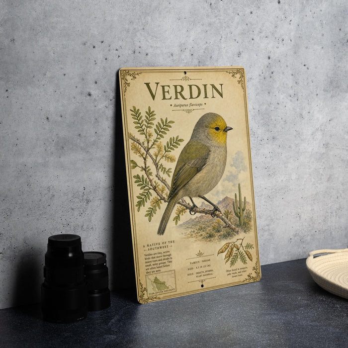 A vintage-style metal sign featuring a detailed illustration of a Verdin, a small yellow and gray bird, perched on a branch with a desert landscape in the background.