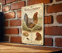 A vintage-style illustration of a chicken, likely a Welsummer Chicken, is displayed on a brick wall.