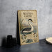 a vintage-style illustration of a Western Grebe, a type of water bird, with a detailed depiction of its natural habitat and behavior.