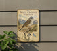a sign depicting a white-crowned sparrow, with a detailed illustration of the bird and its natural habitat.