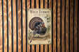 A vintage-style poster of a wild turkey is displayed on a wooden wall, featuring a detailed illustration of the turkey and its natural surroundings.