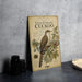 a vintage-style book or magazine cover with a detailed illustration of a yellow-billed cuckoo bird on a branch, surrounded by various botanical illustrations.
