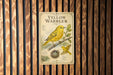 A vintage-style metal sign with illustrations and text, mounted on a wooden wall.
