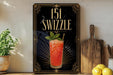 A framed advertisement for a cocktail called "151 Swzzle" featuring a vibrant image of a red drink garnished with a mint leaf.