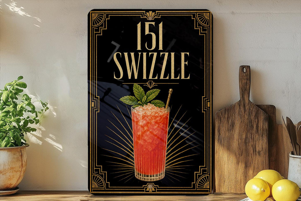 A framed advertisement for a cocktail called "151 Swzzle" featuring a vibrant image of a red drink garnished with a mint leaf.