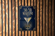 A sign displaying "50/50 Martini" with an illustration of a martini glass.
