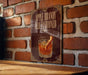 a sign with the text "Apple Brandy Old Fashioned" and an illustration of a glass of whiskey with an apple slice.