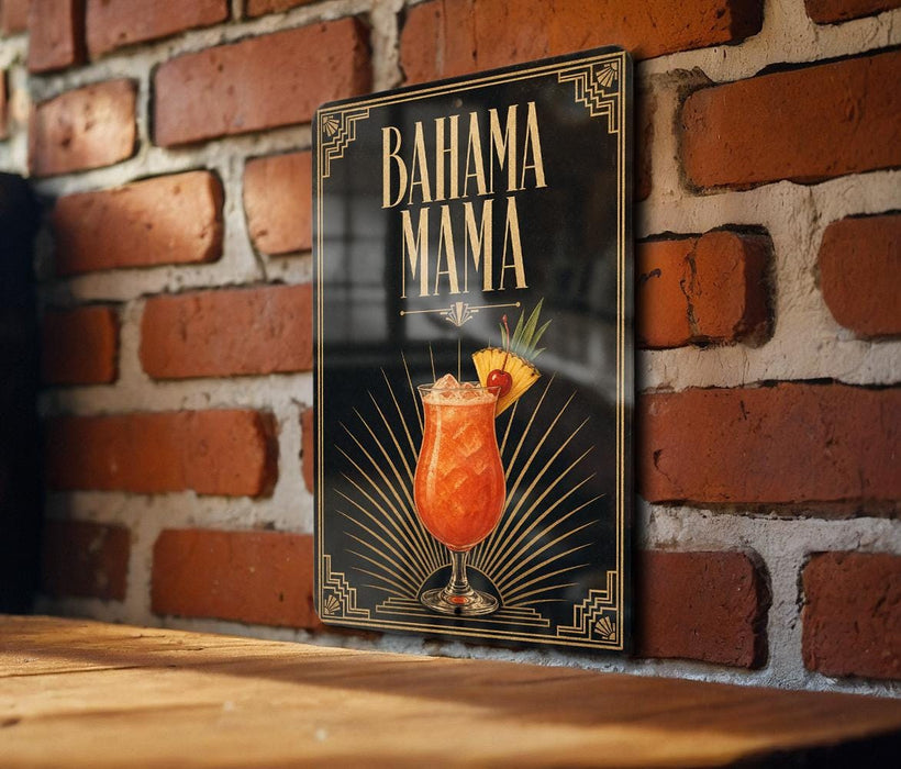 A framed poster of a tropical drink, likely a Bahama Mama cocktail, is displayed on a brick wall.