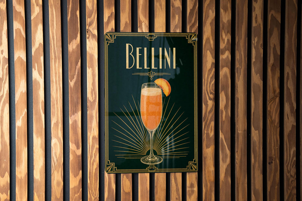 A poster with the word "Bellini" and an illustration of a glass of Bellini cocktail is displayed on a wooden wall.