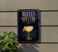 A sign for "Berta's Special" cocktail, featuring a glass illustration and a lemon twist, is displayed on a wall.
