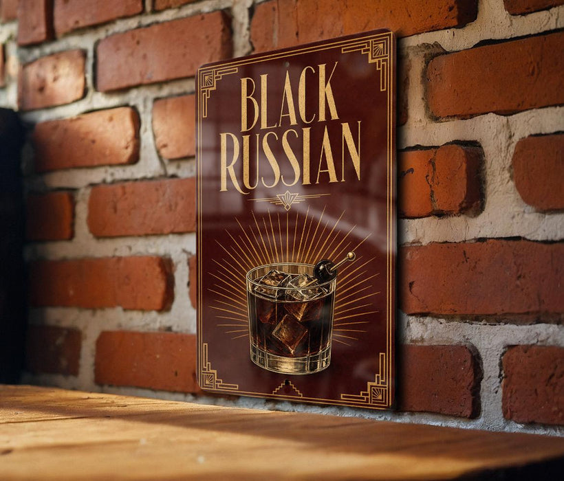 A sign with the text "Black Russian" and an illustration of a cocktail is displayed on a brick wall.