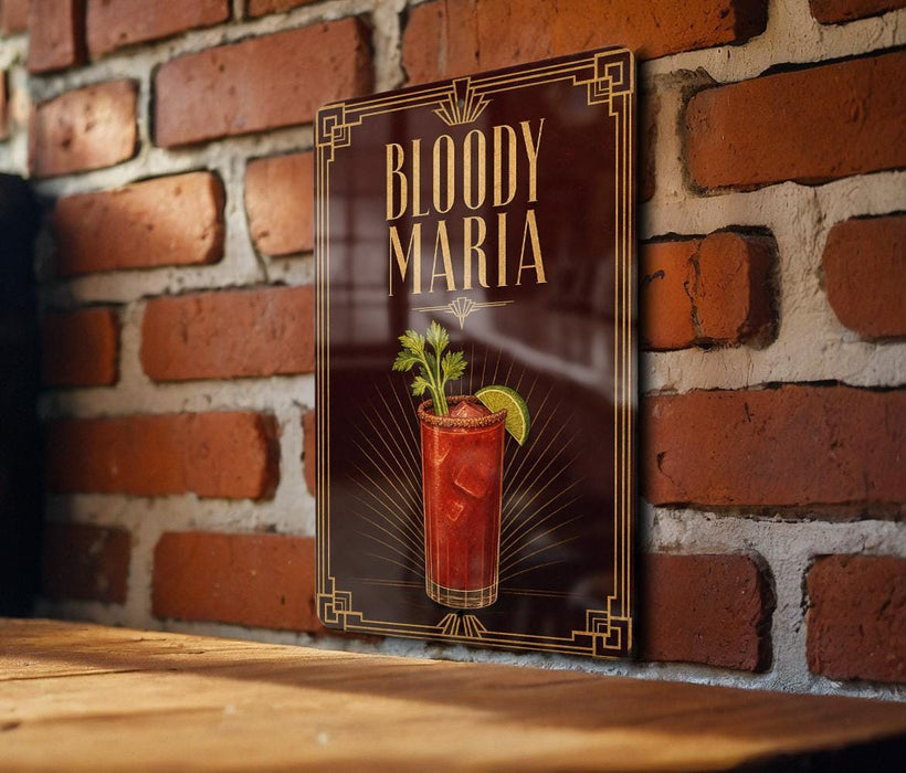 A framed poster of a Bloody Mary cocktail is displayed on a brick wall.