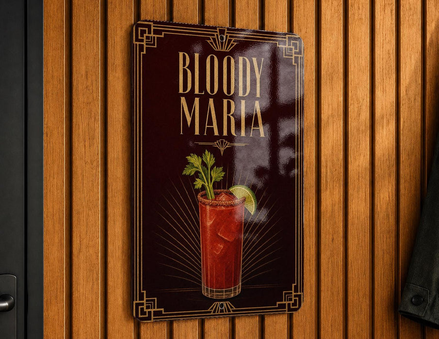 A sign for "Bloody Maria" cocktail, featuring a red drink with a garnish and a lime wedge, is displayed on a wooden wall.