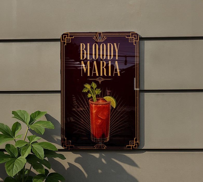 A sign for "Bloody Maria" cocktail is displayed on a wall, featuring an illustration of a red drink with a lime garnish and a crown-like design.