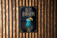 A sign for a Blue Hawaiian cocktail is displayed on a wooden wall.