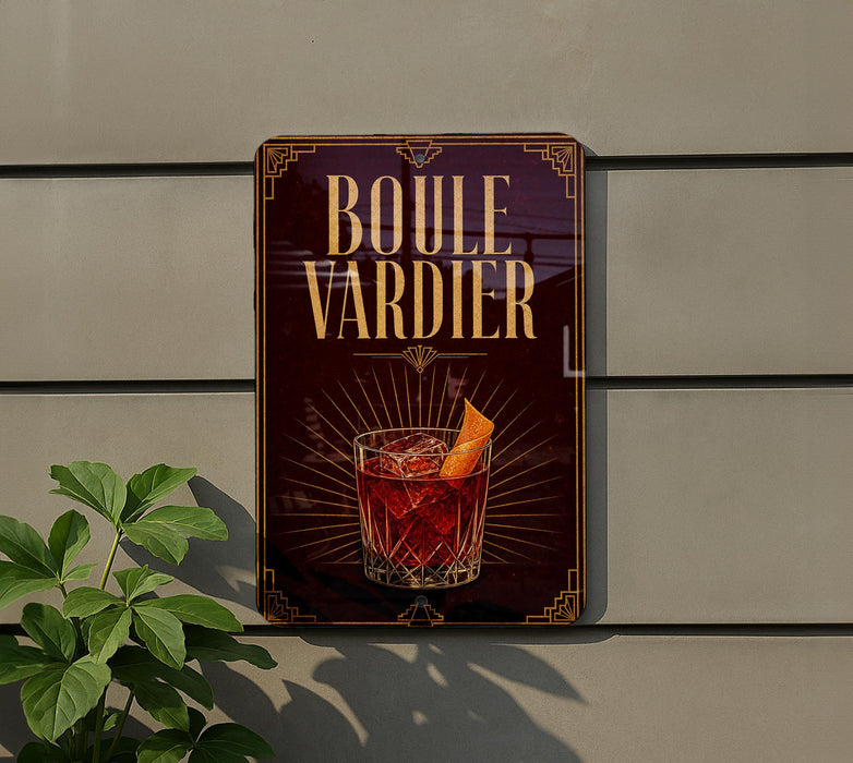 a sign for a drink called "Boule Vardier" with a glass of the drink and an orange peel on the sign.