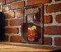 A sign for "Bourbon Buck", featuring an illustration of a cocktail with ice and a lime wedge.