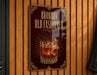 A sign that reads "BOURBON OLD FASHIONED" with an illustration of a glass of amber-colored liquid and a lemon slice.