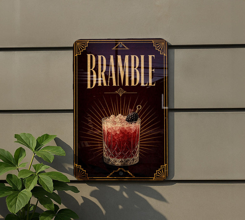 a decorative sign for a drink called "Bramble" with a glass illustration and a garnish on top.