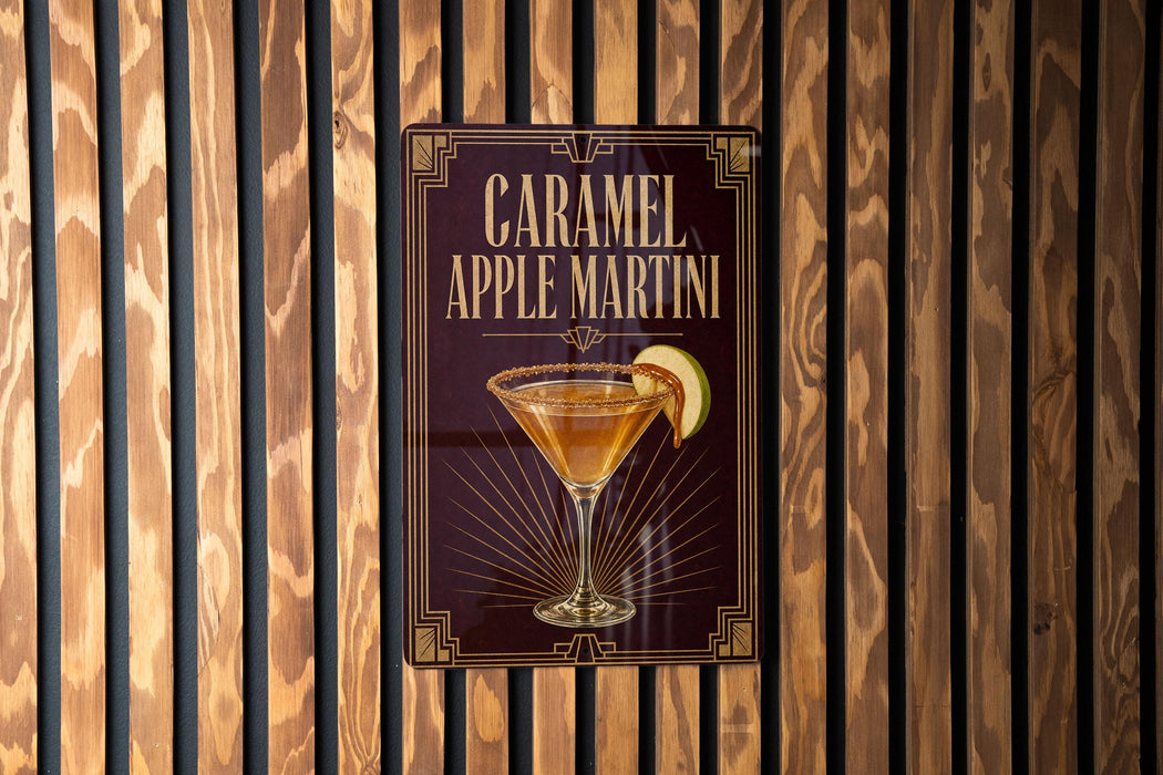 A sign for a caramel apple martini is displayed on a wooden wall.