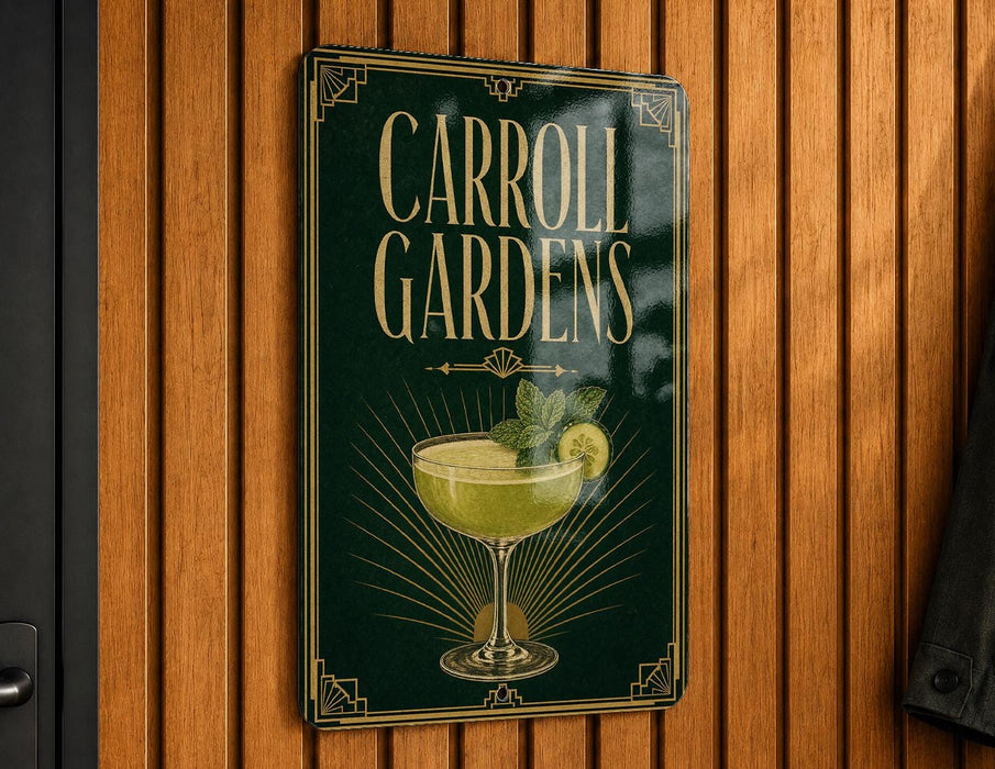 A sign for Carroll Gardens, featuring an illustration of a cocktail glass with a lime garnish.