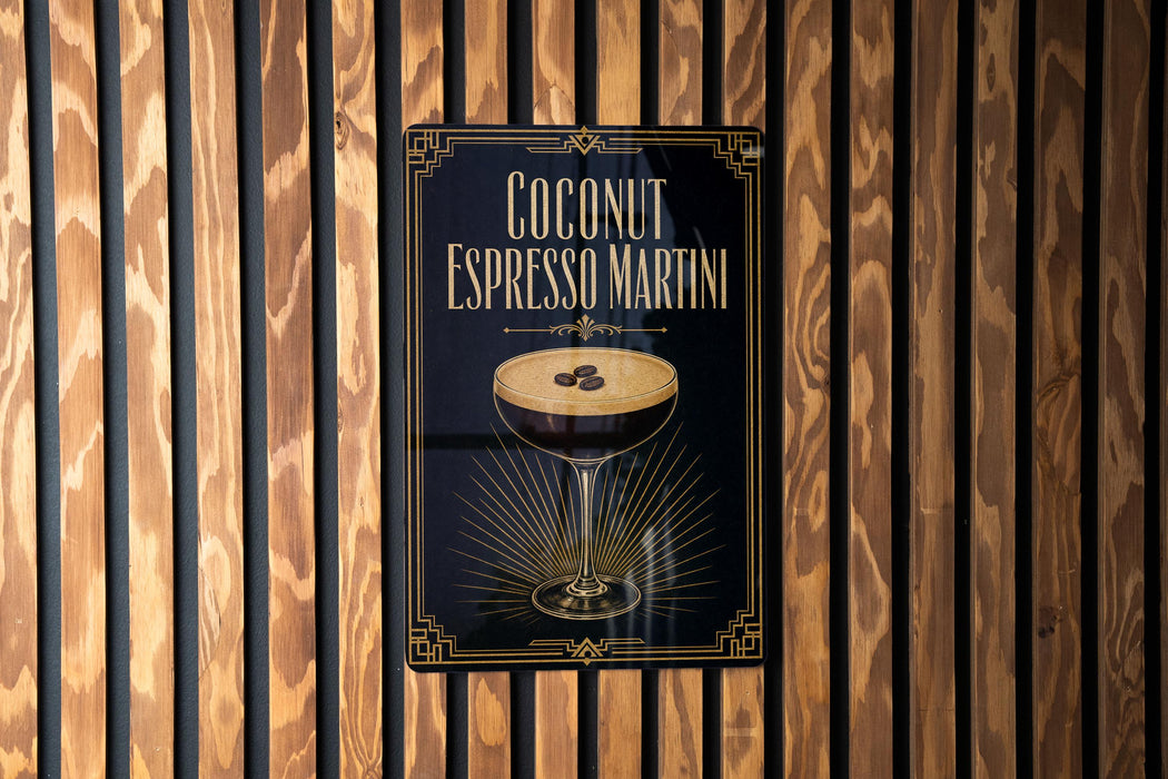 A sign for a coconut espresso martini is displayed on a wooden wall.