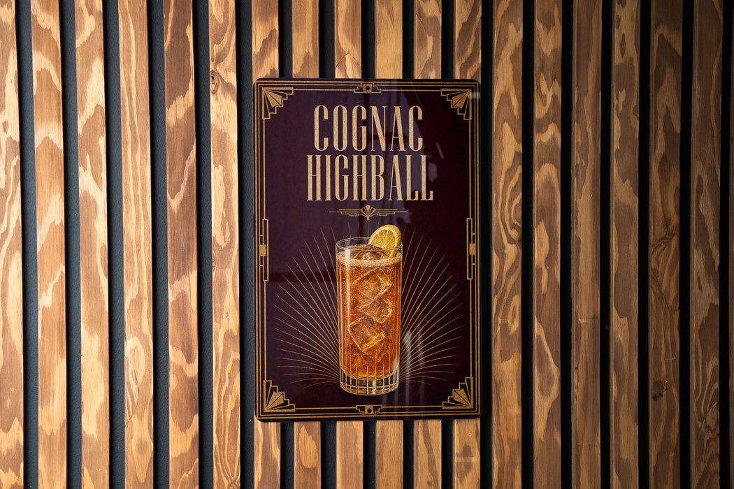 A poster advertising a highball cocktail, featuring a glass of highball with a lemon slice.