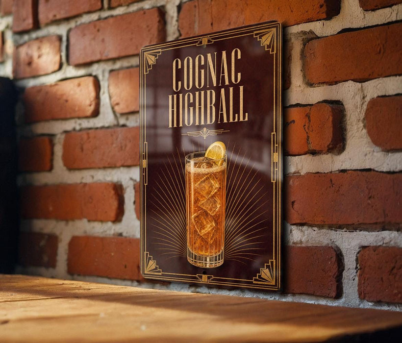 A sign for a cocktail called "Cognac Highball" is displayed on a brick wall.