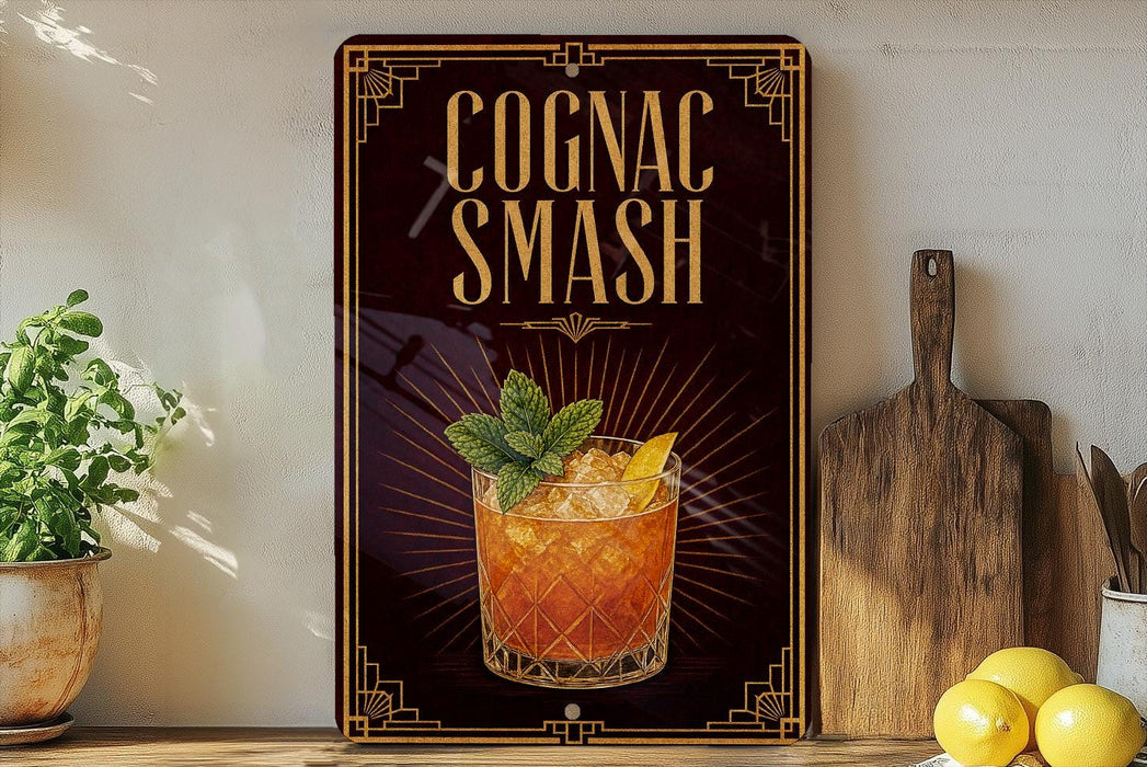 a sign with the text "Cognac Smash" and an illustration of a cocktail, placed on a wooden surface next to a cutting board and some lemons.