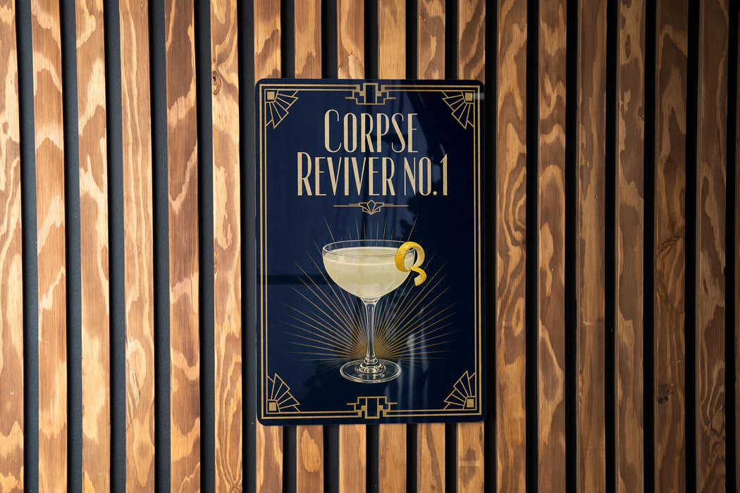a sign with a cocktail glass and a lemon twist, mounted on a wooden wall.