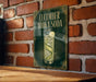 a sign with the text "CUCUMBER VODKA SODA" and an illustration of a cucumber and a glass of cucumber soda.
