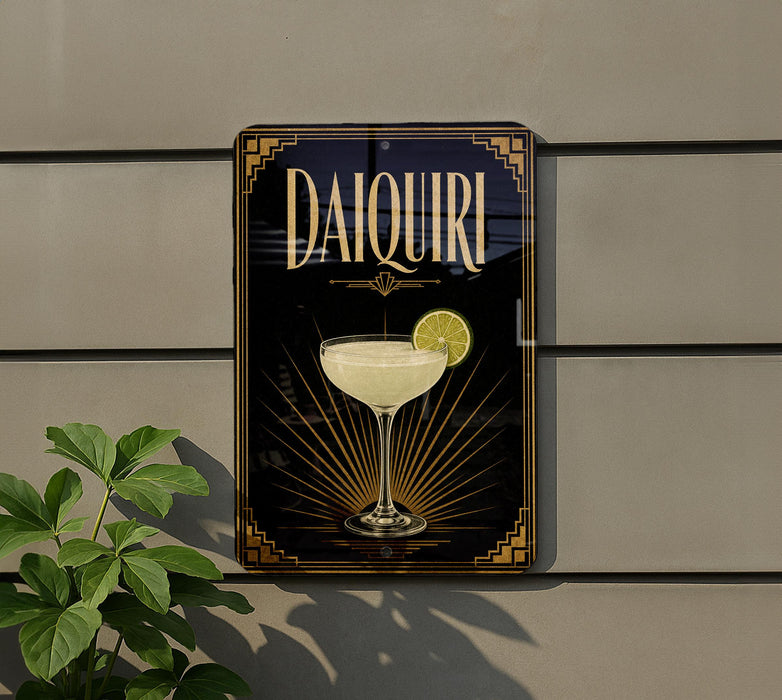 A decorative sign for a Daiquiri cocktail, featuring a glass of the drink and a lemon slice, is displayed on a wall.