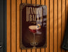 A sign that reads "Diamond Back B" is hanging on a wooden wall.
