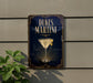 A sign for "DUKE'S MARTINI" is displayed on a wall, featuring an illustration of a martini glass with a lemon twist.
