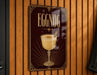 A sign for "Eggnog" is displayed on a wooden wall, featuring an illustration of a glass of eggnog with a cinnamon stick.