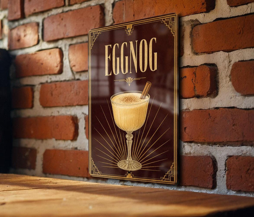 A decorative sign for "Eggnog" hangs on a brick wall, featuring an illustration of a glass filled with eggnog and a cinnamon stick.
